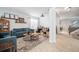 Open-concept living room with modern decor, contemporary furniture, and lots of natural light at 11550 Lake Lucaya Dr, Riverview, FL 33579