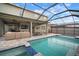 Inviting screened-in pool with a patio and outdoor seating, perfect for relaxing and entertaining at 11550 Lake Lucaya Dr, Riverview, FL 33579