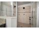Modern tiled shower featuring dual shower heads and glass enclosure at 11550 Lake Lucaya Dr, Riverview, FL 33579