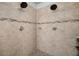 Updated tile shower featuring dual shower heads and built in soap dish at 11550 Lake Lucaya Dr, Riverview, FL 33579