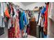 Organized walk-in closet features shelving for shoes and ample hanging space for clothes, luggage and accessories at 11550 Lake Lucaya Dr, Riverview, FL 33579