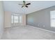 Large carpeted bedroom featuring a vaulted ceiling, a bay window, and neutral walls at 11567 Weston Course Loop, Riverview, FL 33579