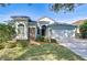Charming one-story home featuring stone accents, manicured landscaping, and an attached two-car garage at 11567 Weston Course Loop, Riverview, FL 33579