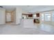Open-concept kitchen with stainless steel appliances, granite countertops, and dark wood cabinetry at 11567 Weston Course Loop, Riverview, FL 33579