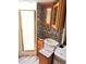 The RV bathroom features a sink, shower and wood cabinets at 1233 Belleair Rd, Clearwater, FL 33756