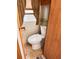 The RV bathroom features a toilet with wood trim and a frosted window at 1233 Belleair Rd, Clearwater, FL 33756