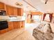 The RV kitchen features stainless steel appliances, oak cabinets, a double sink and the living room at 1233 Belleair Rd, Clearwater, FL 33756