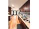 Open kitchen showcasing granite countertops and wood cabinetry at 1233 Belleair Rd, Clearwater, FL 33756