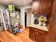 Close-up of kitchen counter with stainless steel refrigerator and adjacent pantry at 1233 Belleair Rd, Clearwater, FL 33756