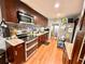 Well-equipped kitchen featuring stainless steel appliances, granite countertops, and dark wood cabinetry at 1233 Belleair Rd, Clearwater, FL 33756