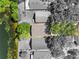 An aerial of the property showing the home’s location with lake access and mature trees at 13409 Fawn Springs Dr, Tampa, FL 33626