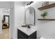 Contemporary bathroom featuring a modern mirror, floating shelves and new vanity at 13409 Fawn Springs Dr, Tampa, FL 33626