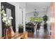 Welcoming foyer leading to an open-concept living space with hardwood floors and serene views at 13409 Fawn Springs Dr, Tampa, FL 33626