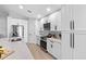 Stylish kitchen with white cabinets, stainless steel appliances, and a subway tile backsplash at 13409 Fawn Springs Dr, Tampa, FL 33626