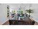 Open-concept living area with a lake view, stylish furnishings, and hardwood floors at 13409 Fawn Springs Dr, Tampa, FL 33626
