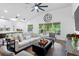 Bright living room with a lake view, stylish furnishings, and an open layout at 13409 Fawn Springs Dr, Tampa, FL 33626