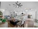 Spacious living room showcasing an open layout, modern furnishings, and hardwood floors at 13409 Fawn Springs Dr, Tampa, FL 33626
