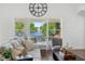 Serene living room with natural light and a beautiful lake view, complete with stylish furnishings and decor at 13409 Fawn Springs Dr, Tampa, FL 33626