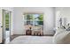 Bright main bedroom featuring a large window with views of the water and natural surroundings at 13409 Fawn Springs Dr, Tampa, FL 33626