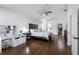 Spacious main bedroom with hardwood floors, a ceiling fan, and a walk-in closet at 13409 Fawn Springs Dr, Tampa, FL 33626