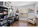 Bright office featuring hardwood floors, gallery wall, and large window at 13409 Fawn Springs Dr, Tampa, FL 33626