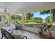 Enjoy outdoor living with this screened patio, grill, and scenic views of the lake at 13409 Fawn Springs Dr, Tampa, FL 33626