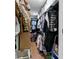 Well-organized walk-in closet with shelving and hanging storage, perfect for wardrobe management at 13409 Fawn Springs Dr, Tampa, FL 33626