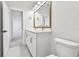 Bright bathroom featuring a double vanity, stylish fixtures, and a large mirror at 1586 Running Tide Pl, Sarasota, FL 34240