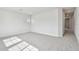 Spacious carpeted bedroom with natural light and neutral color palette, perfect for relaxation at 1586 Running Tide Pl, Sarasota, FL 34240
