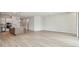 Open floor plan featuring modern kitchen with island and bright living space with large sliding doors at 1586 Running Tide Pl, Sarasota, FL 34240