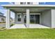Covered patio space with recessed lighting and views of the landscaped backyard at 1586 Running Tide Pl, Sarasota, FL 34240