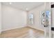 Well-lit study featuring wood-look floors, white walls, recessed lights, and large windows at 1586 Running Tide Pl, Sarasota, FL 34240