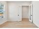 Well-lit study featuring wood-look floors, white walls, recessed lights, and glass panel doors at 1586 Running Tide Pl, Sarasota, FL 34240