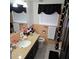 Bright bathroom featuring granite counters, a white sink, and black fixtures at 1663 Cambridge Dr, Clearwater, FL 33756