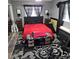 Cozy bedroom with dark accents, neutral walls, an area rug, and lots of natural light at 1663 Cambridge Dr, Clearwater, FL 33756