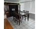 Dining room featuring tile floors and a dark wood dining table at 1663 Cambridge Dr, Clearwater, FL 33756