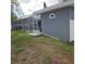 View of a screened patio with a pool in the backyard of the house at 1663 Cambridge Dr, Clearwater, FL 33756