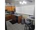 A charming kitchen with tile flooring and a cozy breakfast nook at 1663 Cambridge Dr, Clearwater, FL 33756