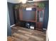 Home office with built-in shelving, a desk, and wood-look flooring at 1663 Cambridge Dr, Clearwater, FL 33756