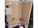 Bathroom with peach tile in shower and dark shower curtain at 1663 Cambridge Dr, Clearwater, FL 33756