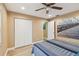 Bedroom with ceiling fan, closet, and décor with an outdoor motif and natural light at 1666 Pine Pl, Clearwater, FL 33755