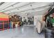Organized two-car garage with tool cabinets, work bench, bikes, and equipment at 1666 Pine Pl, Clearwater, FL 33755