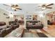 A living room featuring recessed lighting, ceiling fans, and comfortable seating at 1666 Pine Pl, Clearwater, FL 33755