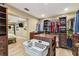 A large walk in closet with custom shelves, drawers, hanging racks, and adjoining bedroom at 1666 Pine Pl, Clearwater, FL 33755