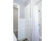 Modern bathroom with a tiled tub/shower, linen closet, and neutral color palette creates a relaxing spa feel at 1713 W Louisiana Ave, Tampa, FL 33603