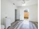 Bathroom with white vanity, toilet, and access to an outdoor space with a wood fence at 1713 W Louisiana Ave, Tampa, FL 33603