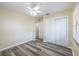 Bright bedroom has vinyl flooring, a ceiling fan, and a double door closet at 1713 W Louisiana Ave, Tampa, FL 33603