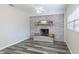 Cozy room features a brick fireplace and decorative mantle and hearth at 1713 W Louisiana Ave, Tampa, FL 33603