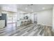 Open kitchen featuring white cabinets, modern appliances, and bar seating with easy access to the pool area at 1713 W Louisiana Ave, Tampa, FL 33603