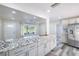 Bright, open kitchen with granite countertops, stainless appliances, and views into the living room at 1713 W Louisiana Ave, Tampa, FL 33603